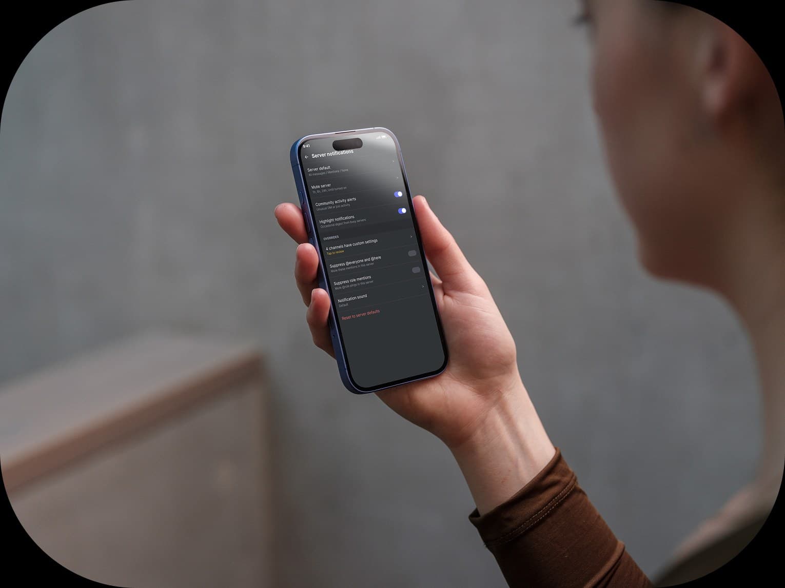 Discord server notifications screen shown in a lifestyle phone mockup