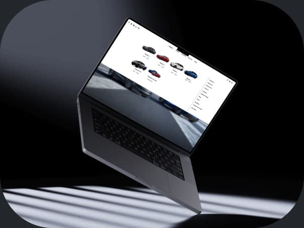 Tesla vehicle mega-menu navigation shown on a laptop mockup