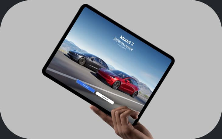 Tesla Model 3 page shown on a tablet mockup held in hand